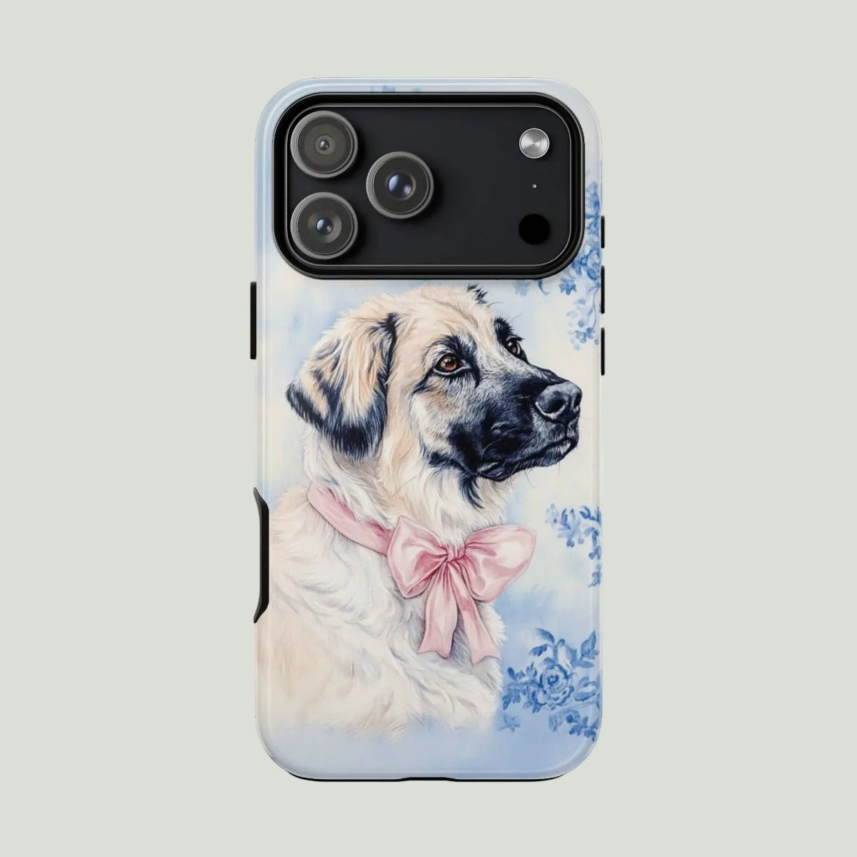 Phone case with a dog illustration and floral design on a light gray background