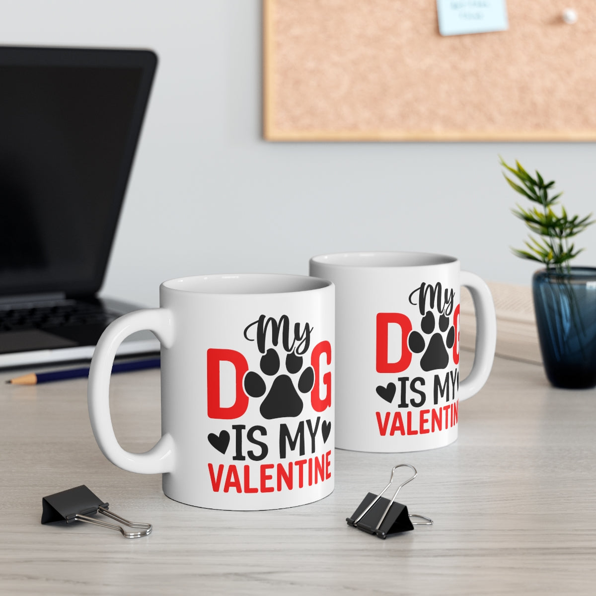 Two mugs with 'My Dog is My Valentine' text on a desk with office supplies.