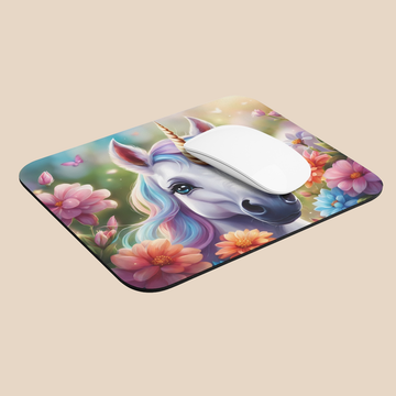 Mouse pad with a unicorn design on a beige background