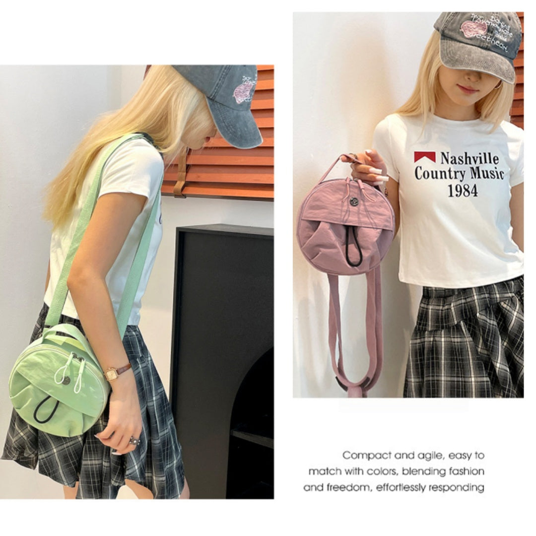 Crayon pink Fashionable Round Crossbody Bag with Water-Resistant Nylon and Multi-Pocket Design for Daily Travel Lightweight Hands-Free Storage Solution for Local Professionals