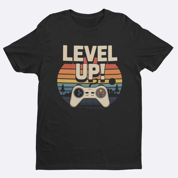 Black t-shirt with 'Level Up!' graphic design featuring a gaming controller and sunset.