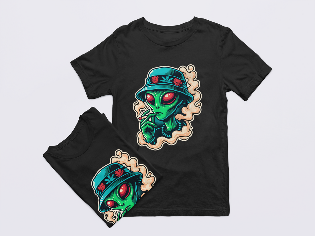Black t-shirt with alien design on a light gray background