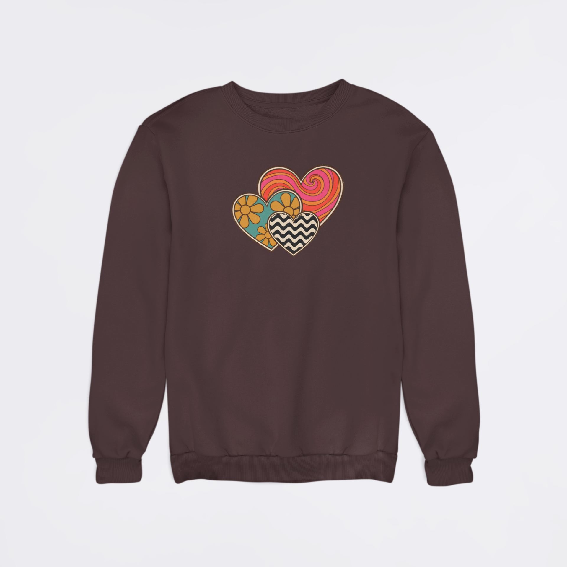 Brown sweatshirt with colorful heart design on a light gray background