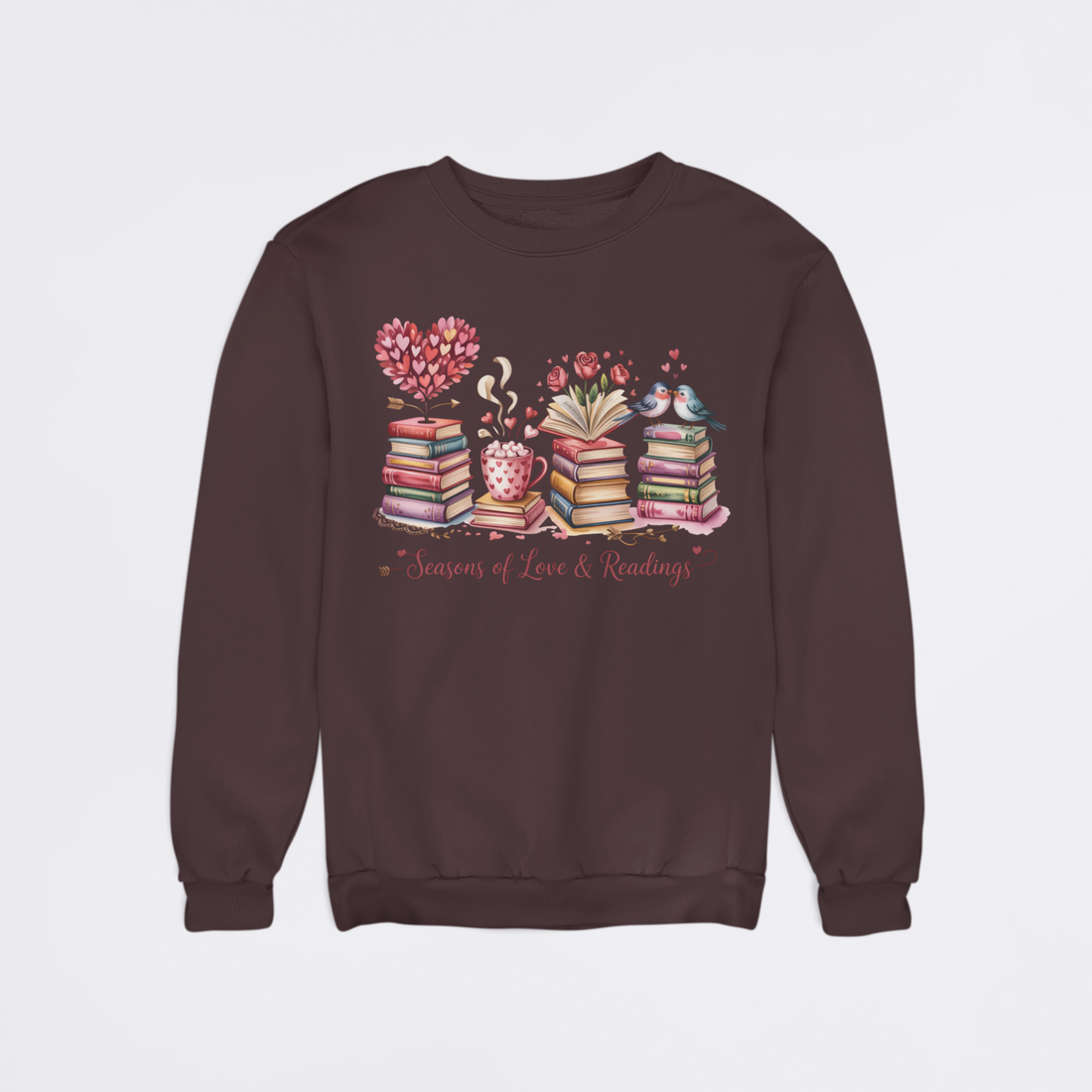 Black sweatshirt with a colorful design of books, a heart, and a teacup on a light gray background.