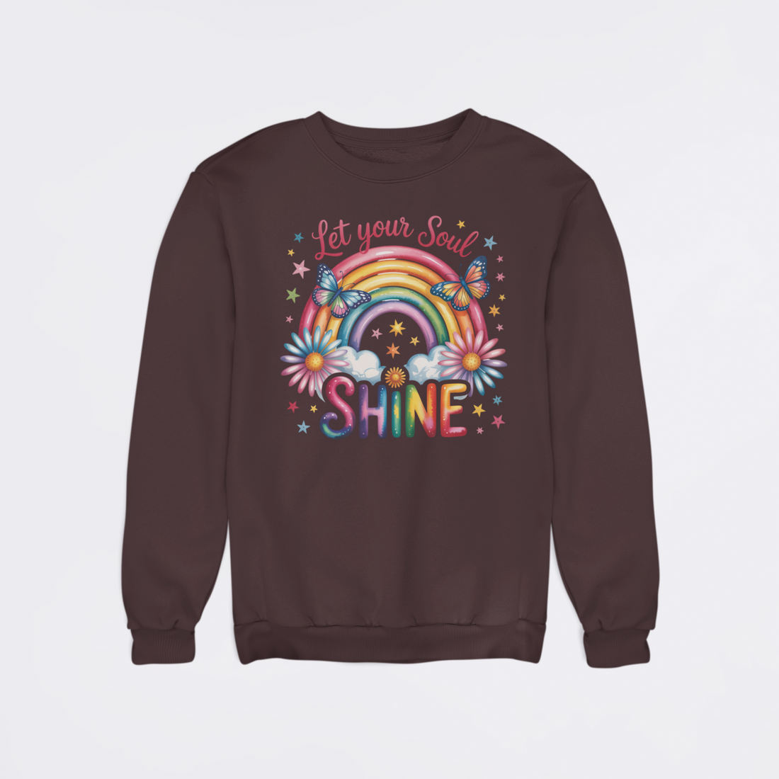 Beige sweatshirt with colorful graphic and 'Let your Soul Shine' text on a light gray background