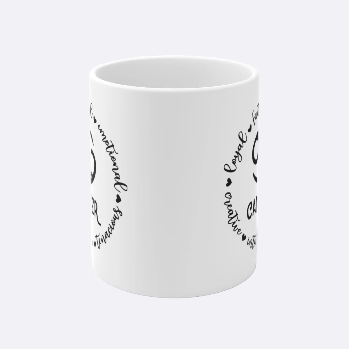 White mug with black text and heart designs on a white background