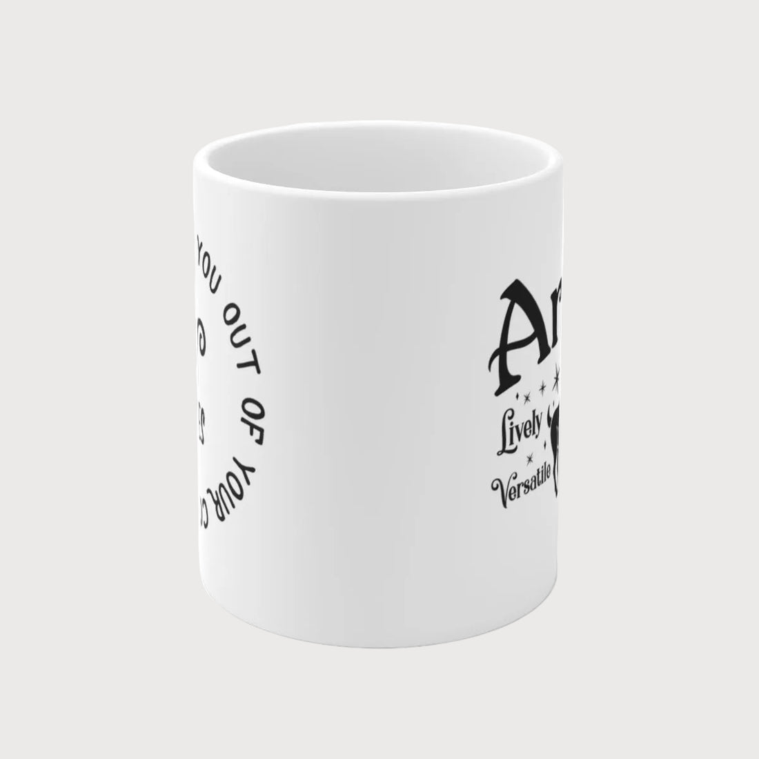 White mug with black text and Aries symbol on a light gray background