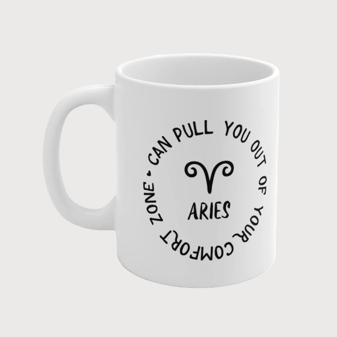 White mug with black text and Aries symbol on a light gray background