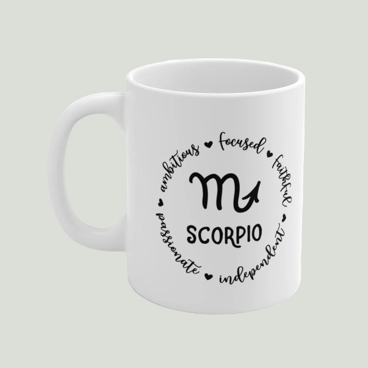 White mug with Scorpio zodiac design and text on a light gray background