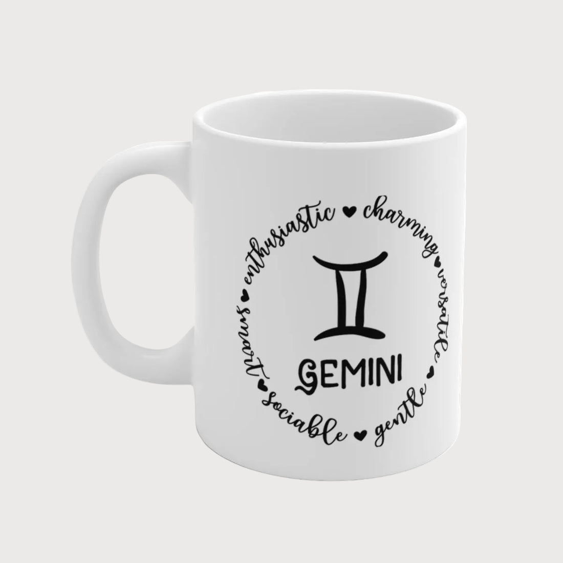 White mug with black Gemini zodiac design on a white background