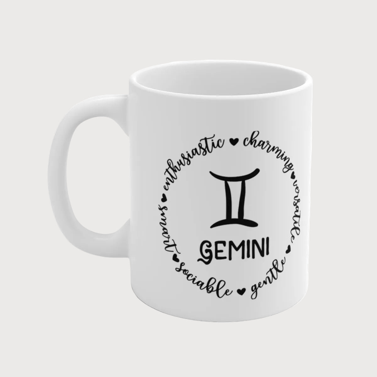 White mug with black Gemini zodiac design on a white background