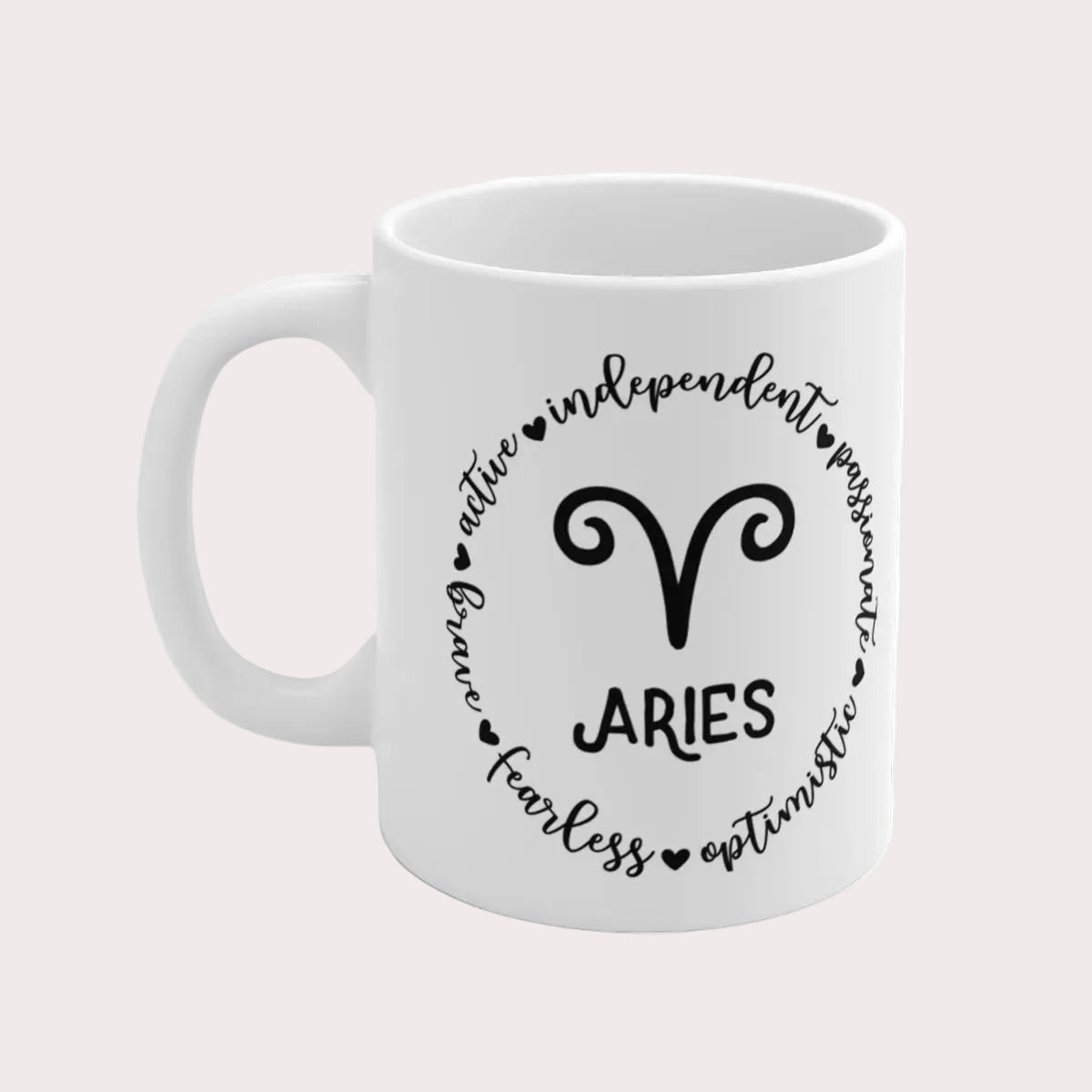 White mug with Aries zodiac design and text on a white background