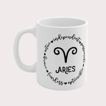 White mug with Aries zodiac design and text on a white background