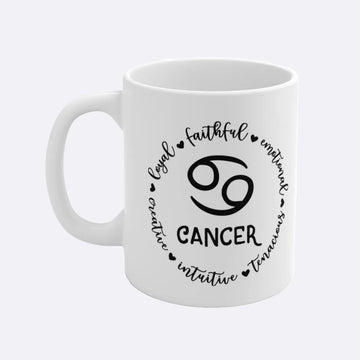 White mug with Cancer zodiac design and attributes on a white background