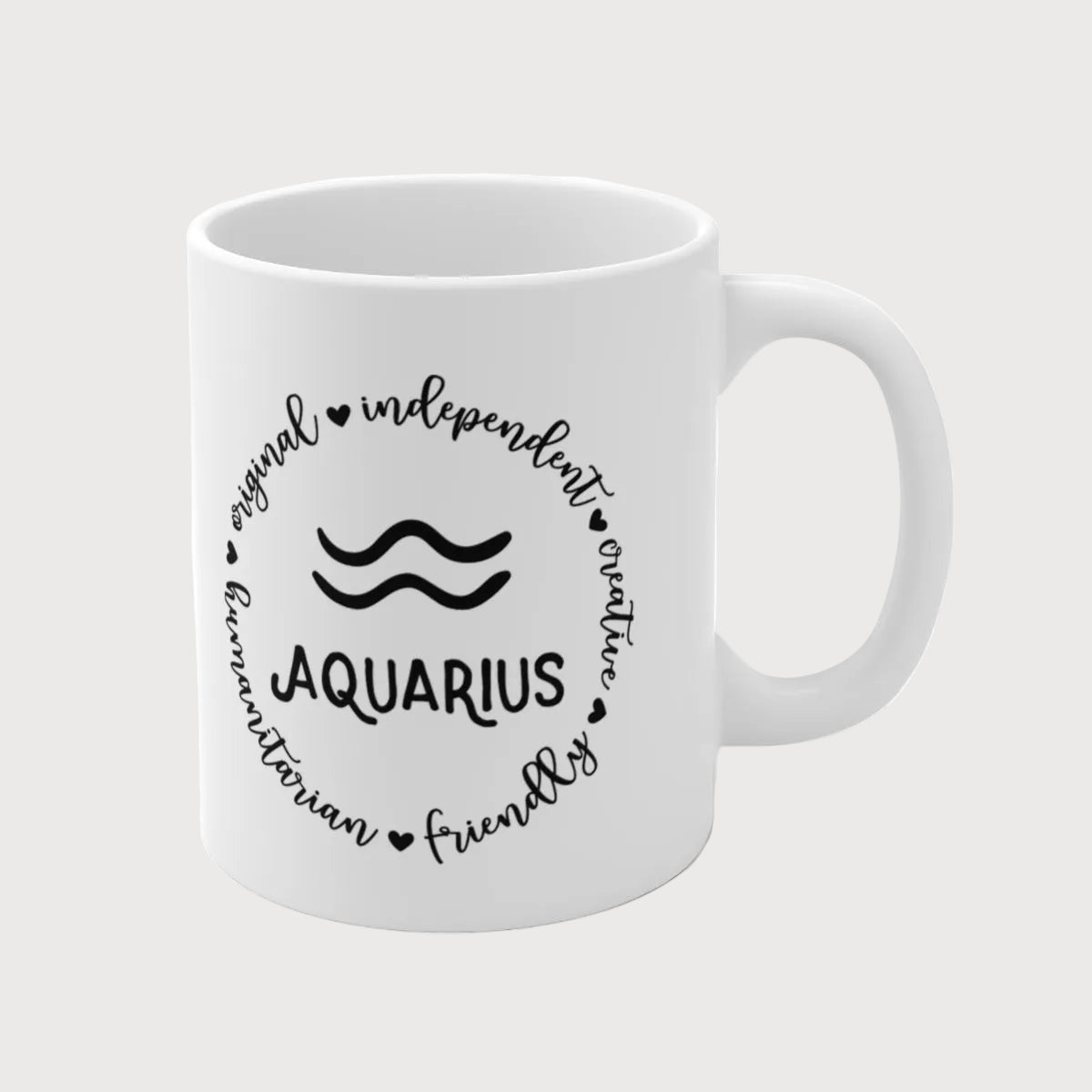 White mug with black text and Aquarius symbol on a white background