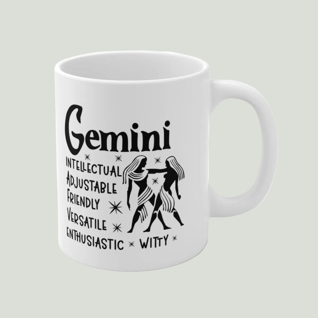 White mug with black Gemini zodiac design and traits on a white background
