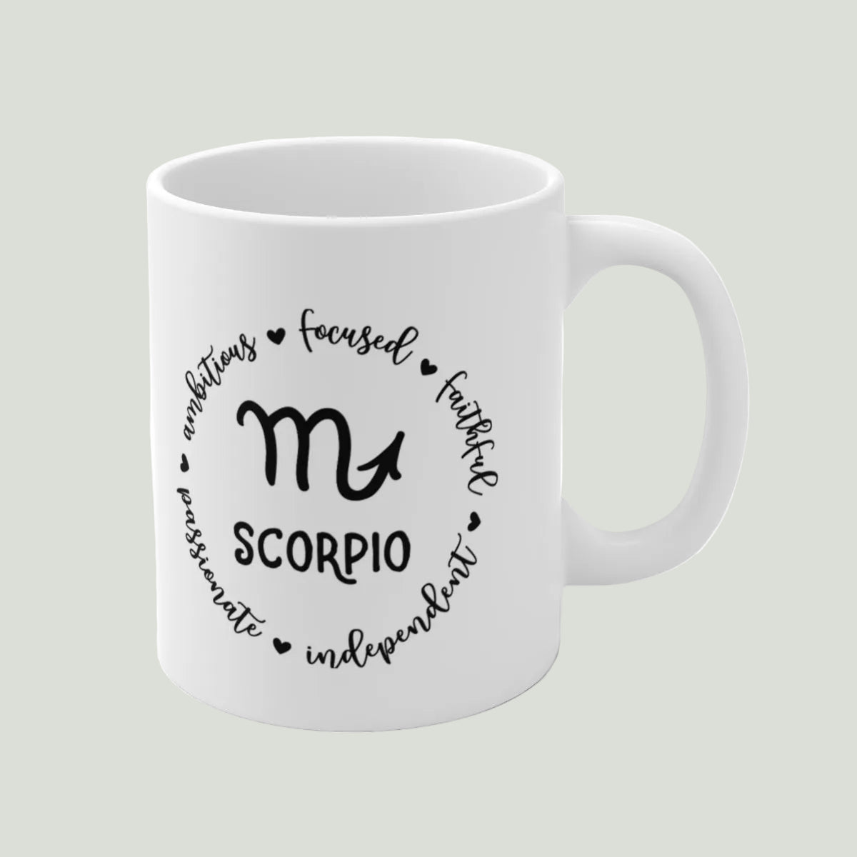 White mug with Scorpio zodiac design and text on a light gray background