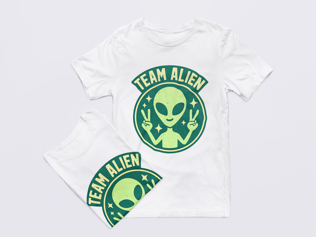 Black t-shirt with green alien graphic and 'Team Alien' text on a light gray background